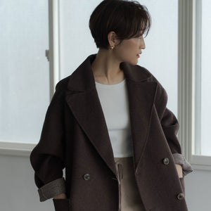 A handmade river coat with large lapels for a modern look